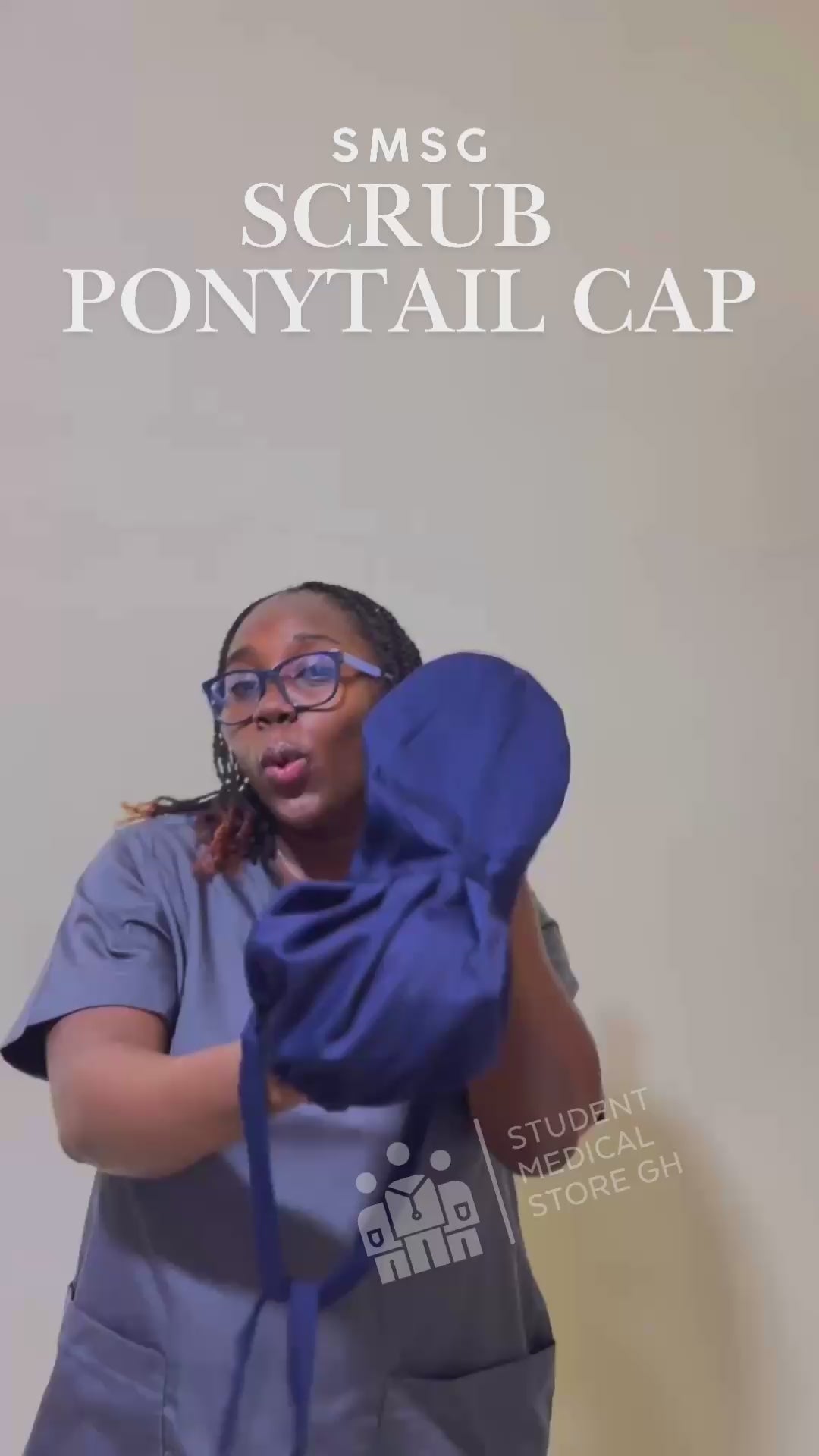 Female doctor demonstrating how to put on the new SMSG ponytail Scrub cap product